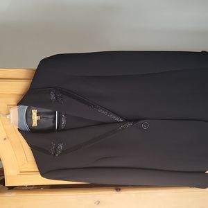 Three piece women's suit with some beading on collar and lapels.